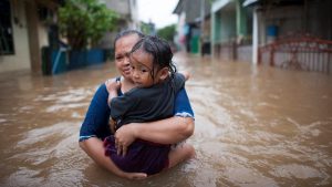 Woman and child in flood